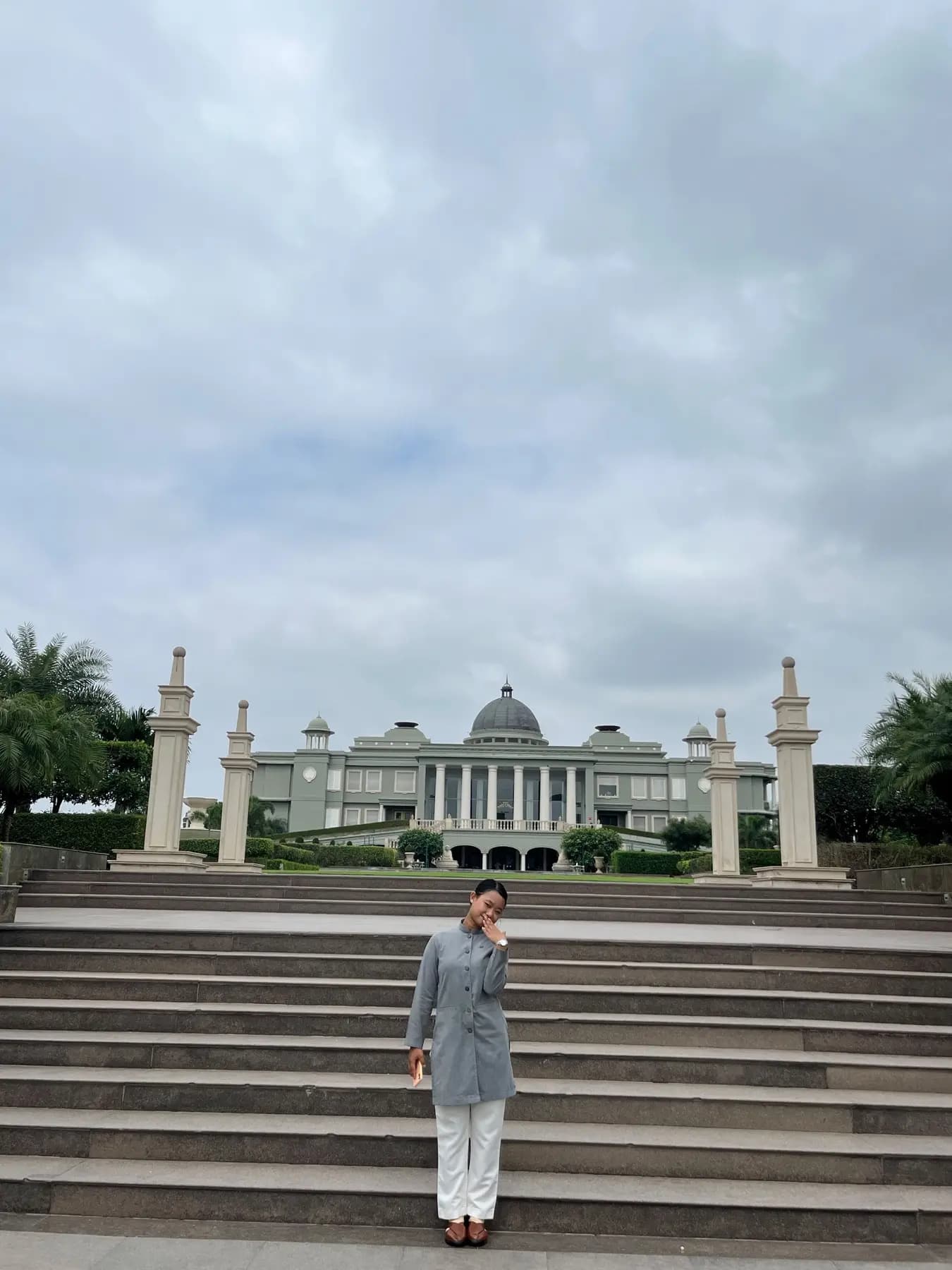A graduate on palace steps